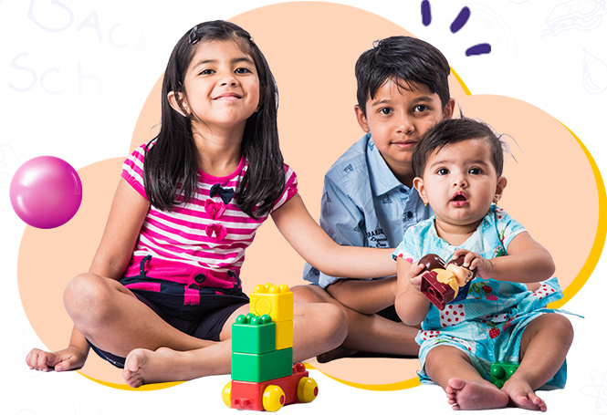 Children sitting and playing with blocks